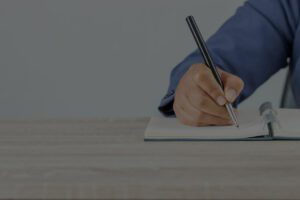 man writing in notebook blog 39