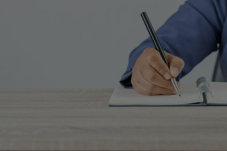 man writing in notebook blog 39